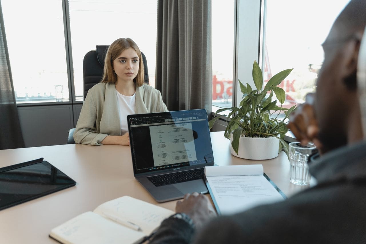 who-we-are A professional job interview scene in a modern office setting, emphasizing recruitment and career opportunities.